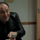 Tony Soprano, played by James Gandolfini, pointing at a Motorola cell phone.